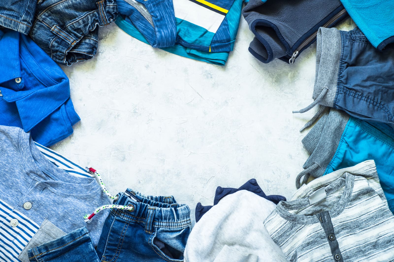 Children's clothing arranged in a top-down flat lay.